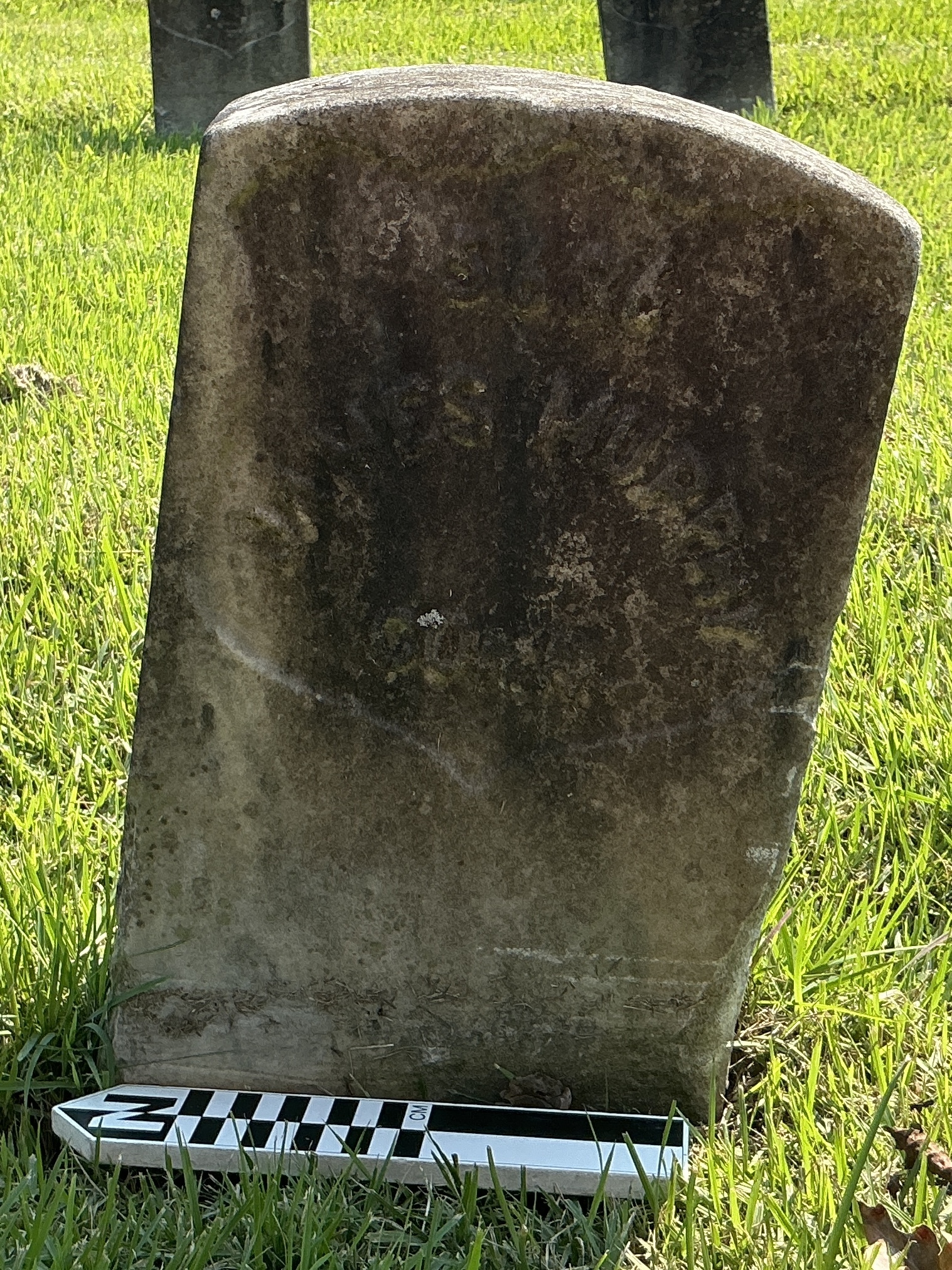 Extra image of historic upright marble headstone with recessed shield face.