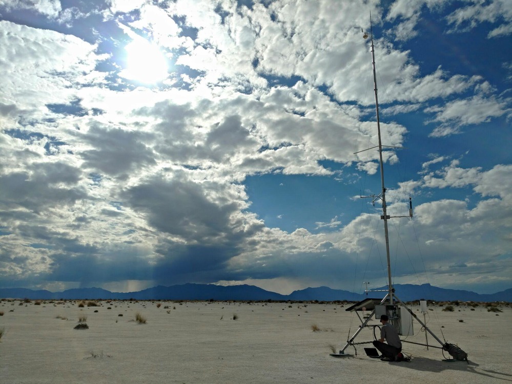 White Sands' park geologist monitors data at one of the park's weather stations.