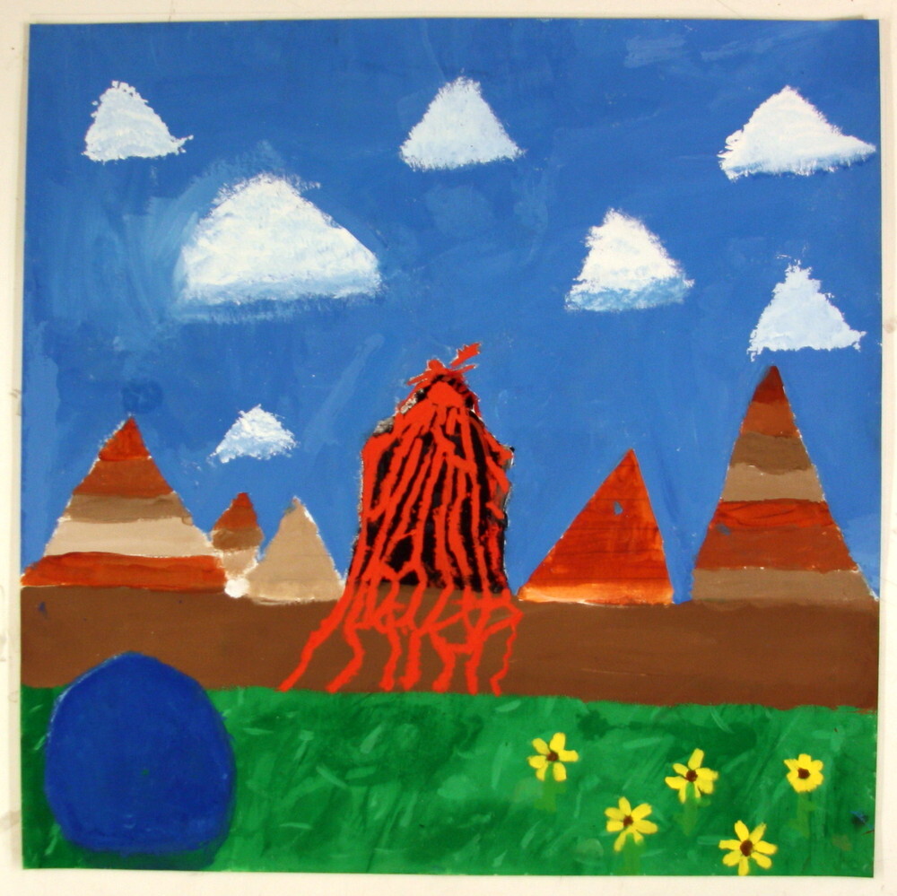 A volcano erupts, surrounded by multi colored hills and puffy white clouds