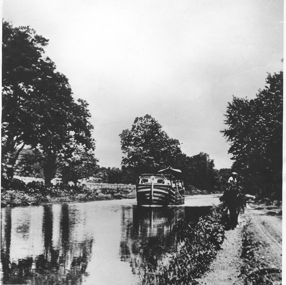 Historic photo of a canal boat being pulled down the canal