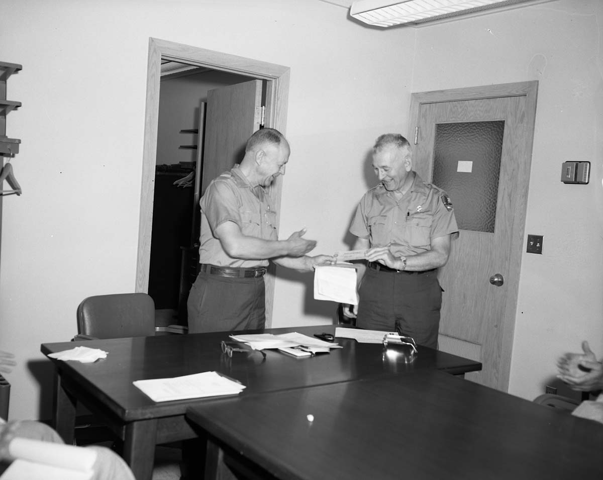 Superintendent Oberhansley presents Assistant Superintendent Charles Humberger with a departmental special citation for outstanding service in the field of safety.