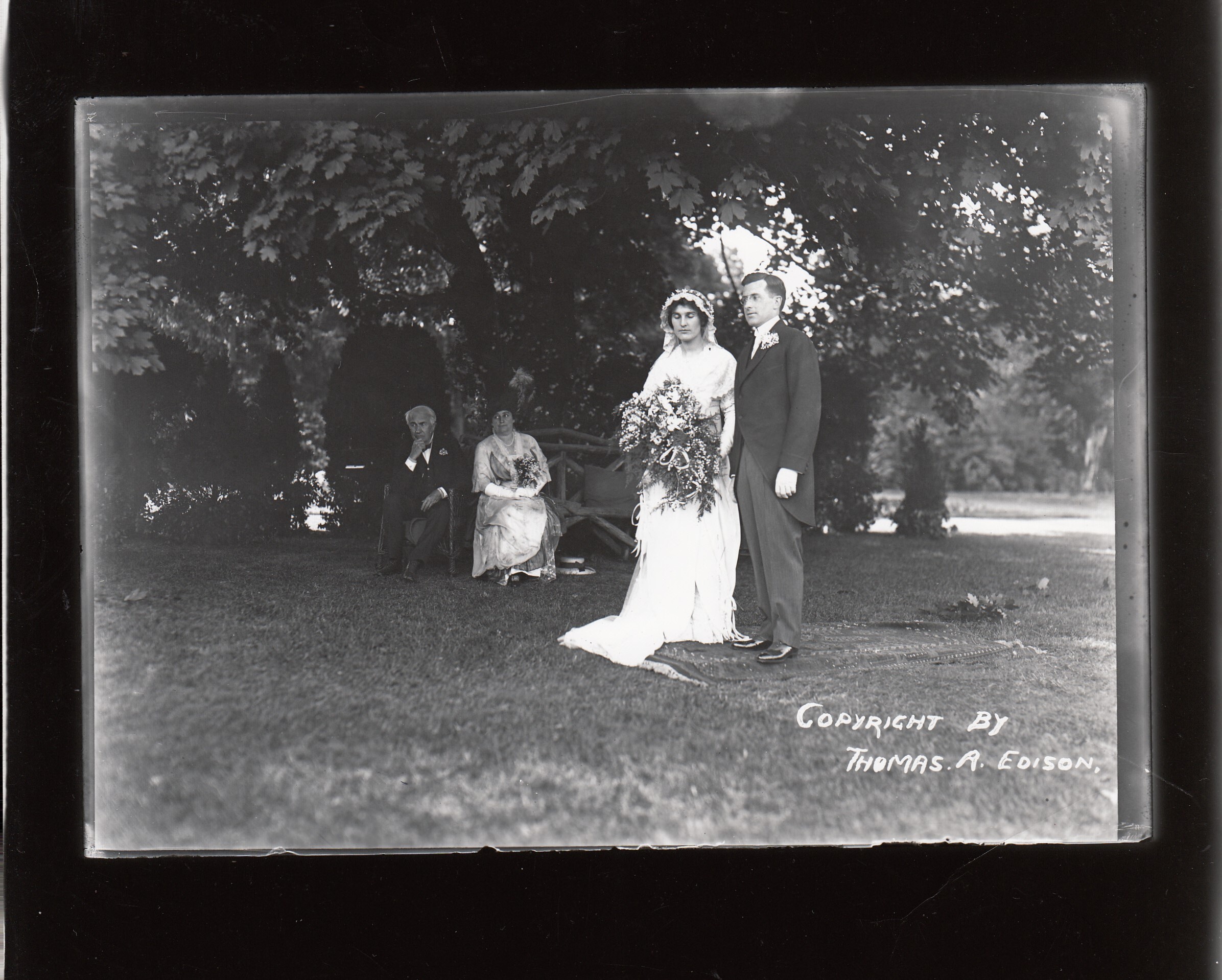 Madeleine Edison and John Eyre Sloane at their wedding on lawn of Glenmont, Thomas Edison and Mina Edison in the background.