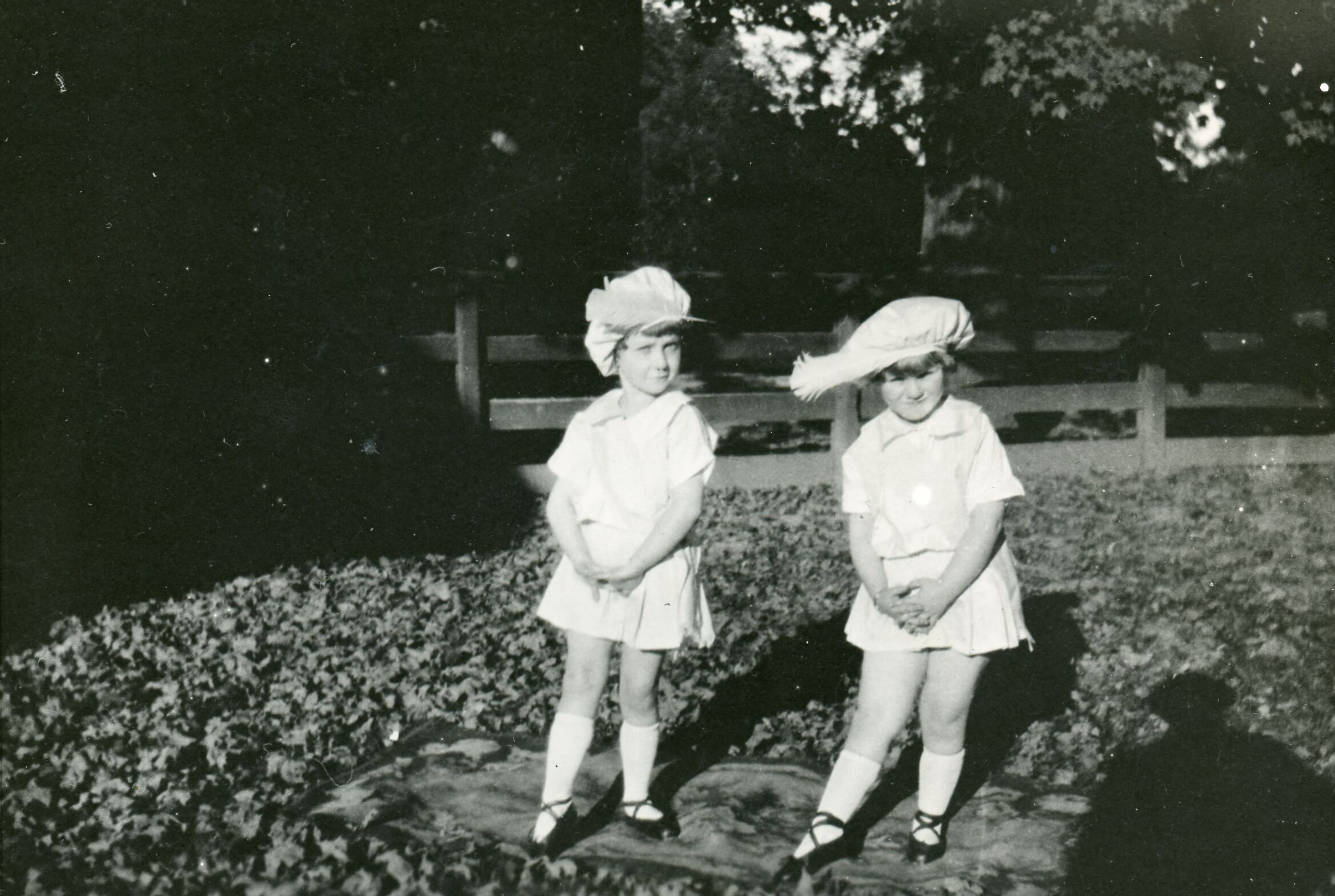 Two young girls, Irma and Beverly Newman, looking at the camera.