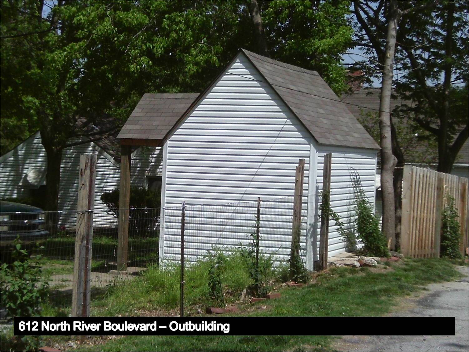 image of a small outbuilding with a gabled roof.