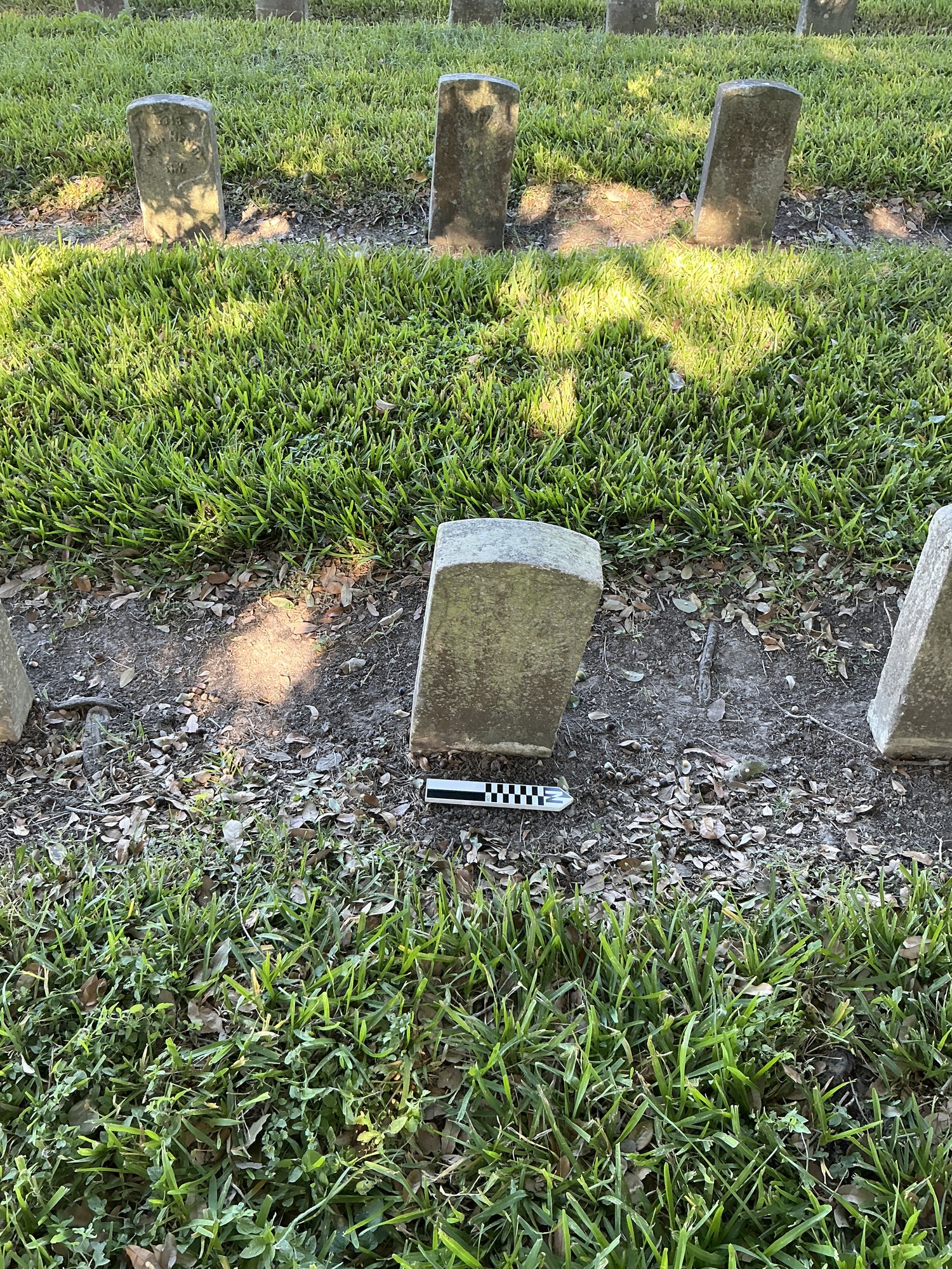 Extra image of historic upright marble headstone with recessed shield face.