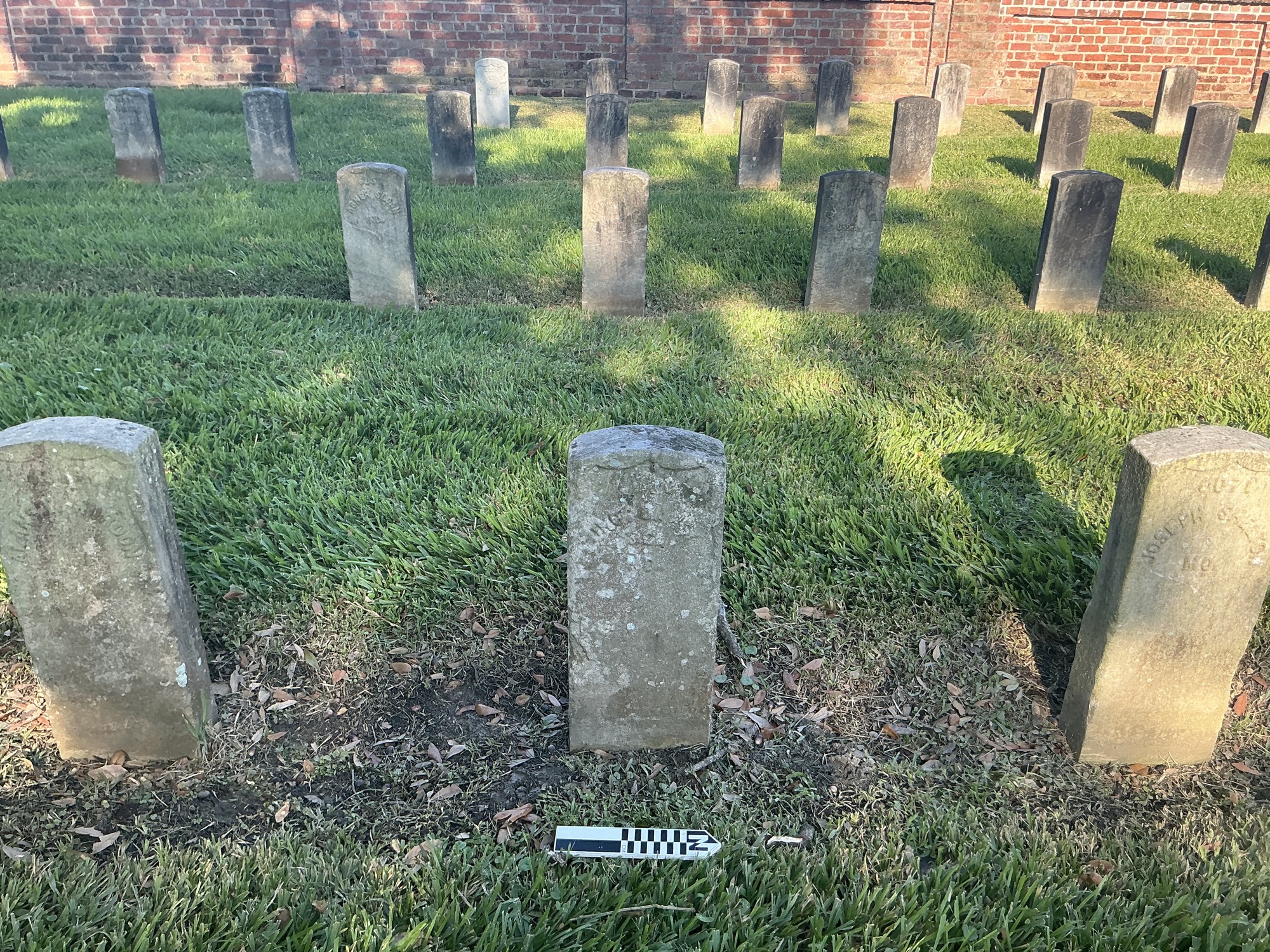 Extra image of historic upright marble headstone with recessed shield face.