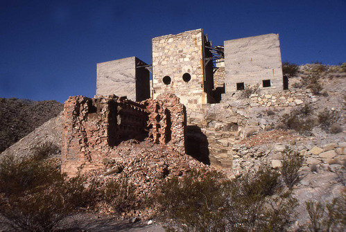 stone buildings on rocky slope