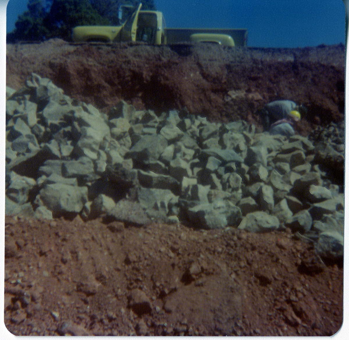 Men piling rocks during road work/repair in Kolob Canyon.