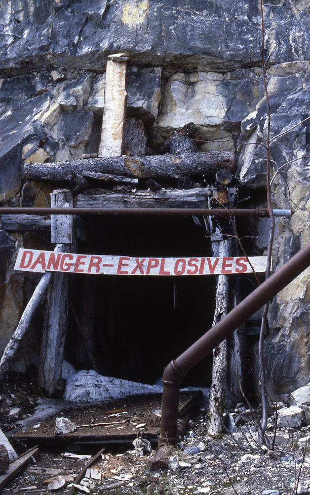 mine opening with sign "danger explosives"