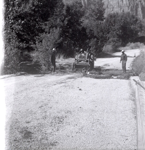 Men repairing section of road along the scenic canyon drive near the Grotto.