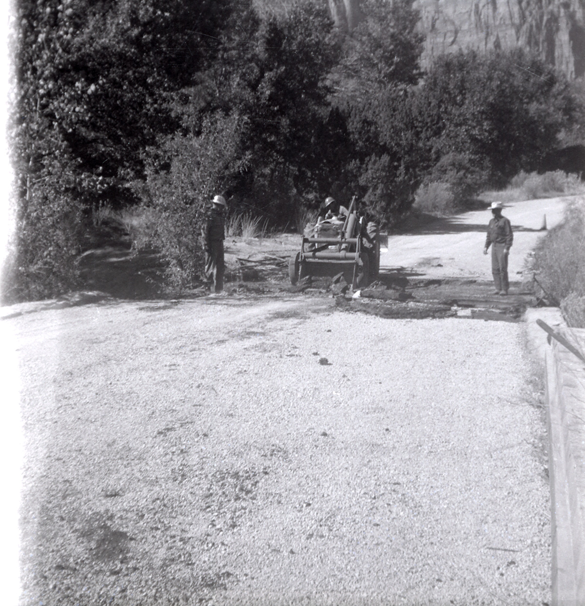 Men repairing section of road along the scenic canyon drive near the Grotto.