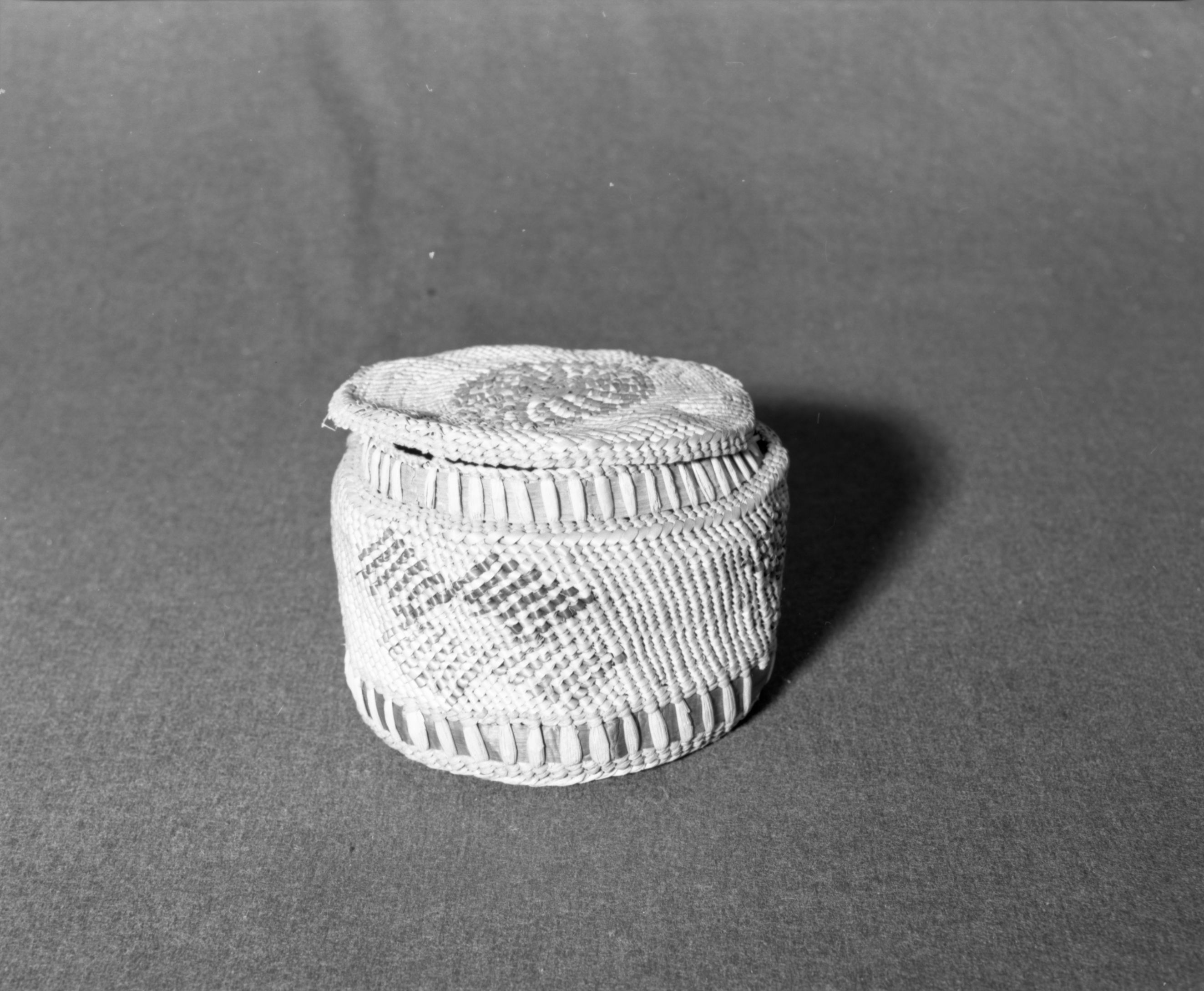 Marie Rozier Collection, Catalog No. 18. Object: Makah (?) basket. Dimensions: 5 x 7". Materials: Red cedar, grass. Technology: Very crude compared to most Makah work. Collection History: Acquired from G. DuGay. Photographed by Michael Dixon in December 1982. Catalogued by Craig Bates and Barbara Beroza. Yosemite Collections, National Park Service.