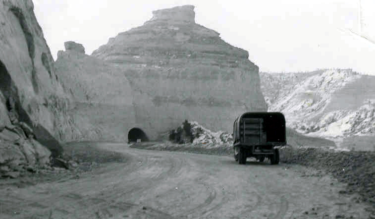 The road is being graded between the first and second tunnels