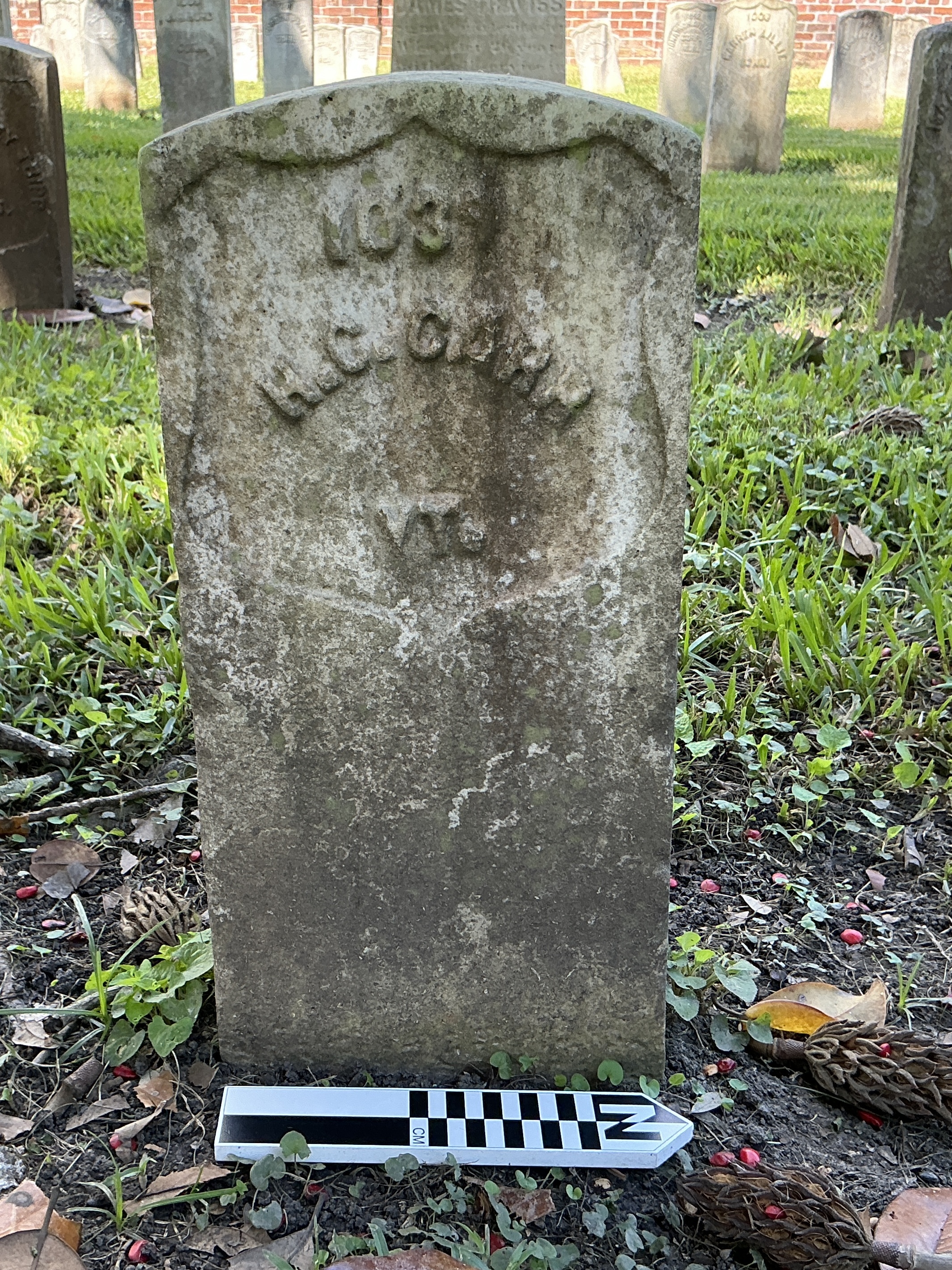 Extra image of historic upright marble headstone with recessed shield face.