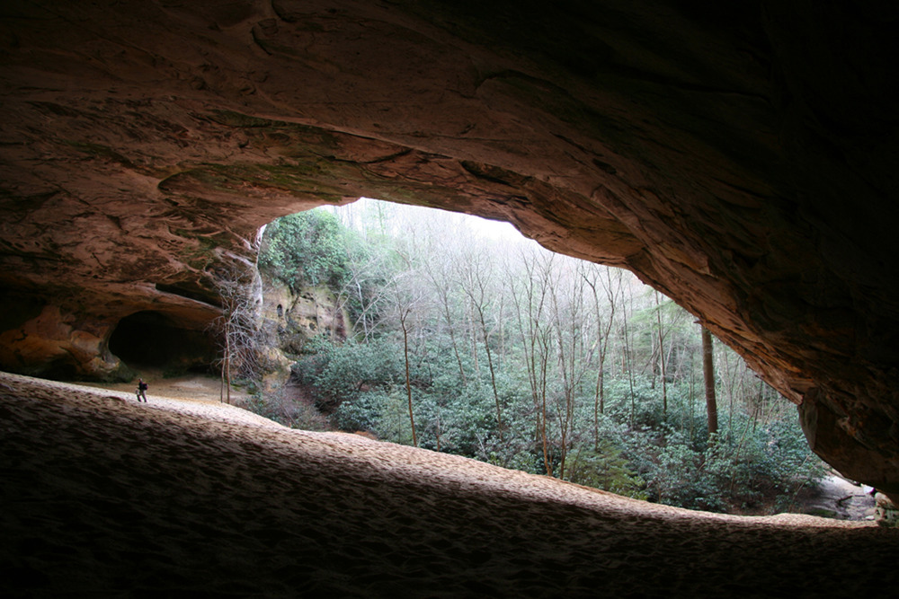 Sand cave with hiker