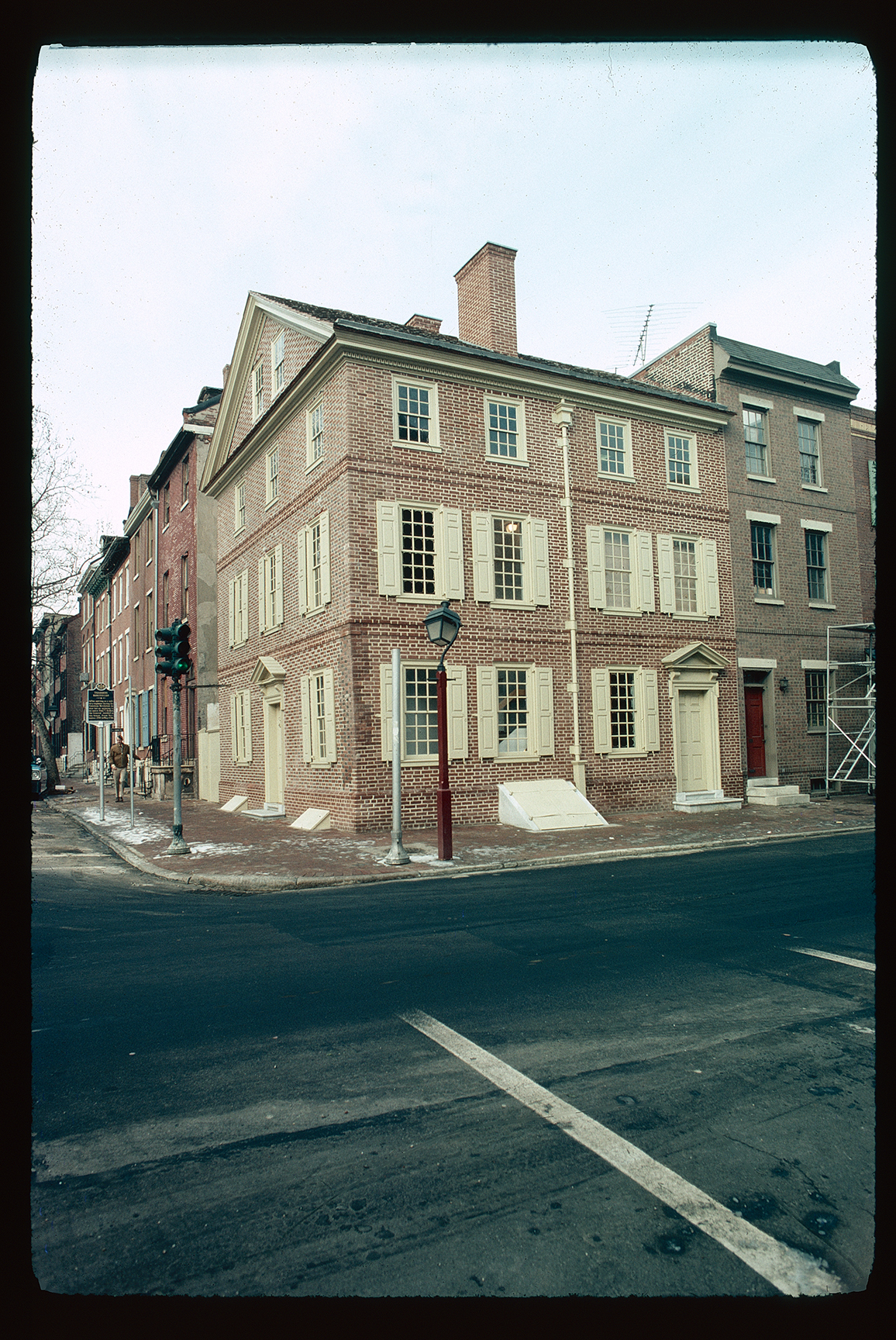 Kosciuszko House. Exterior. Looking northwest from northeast corner of 3rd & Pine Streets. Little snow left on pavements, streetlight green.