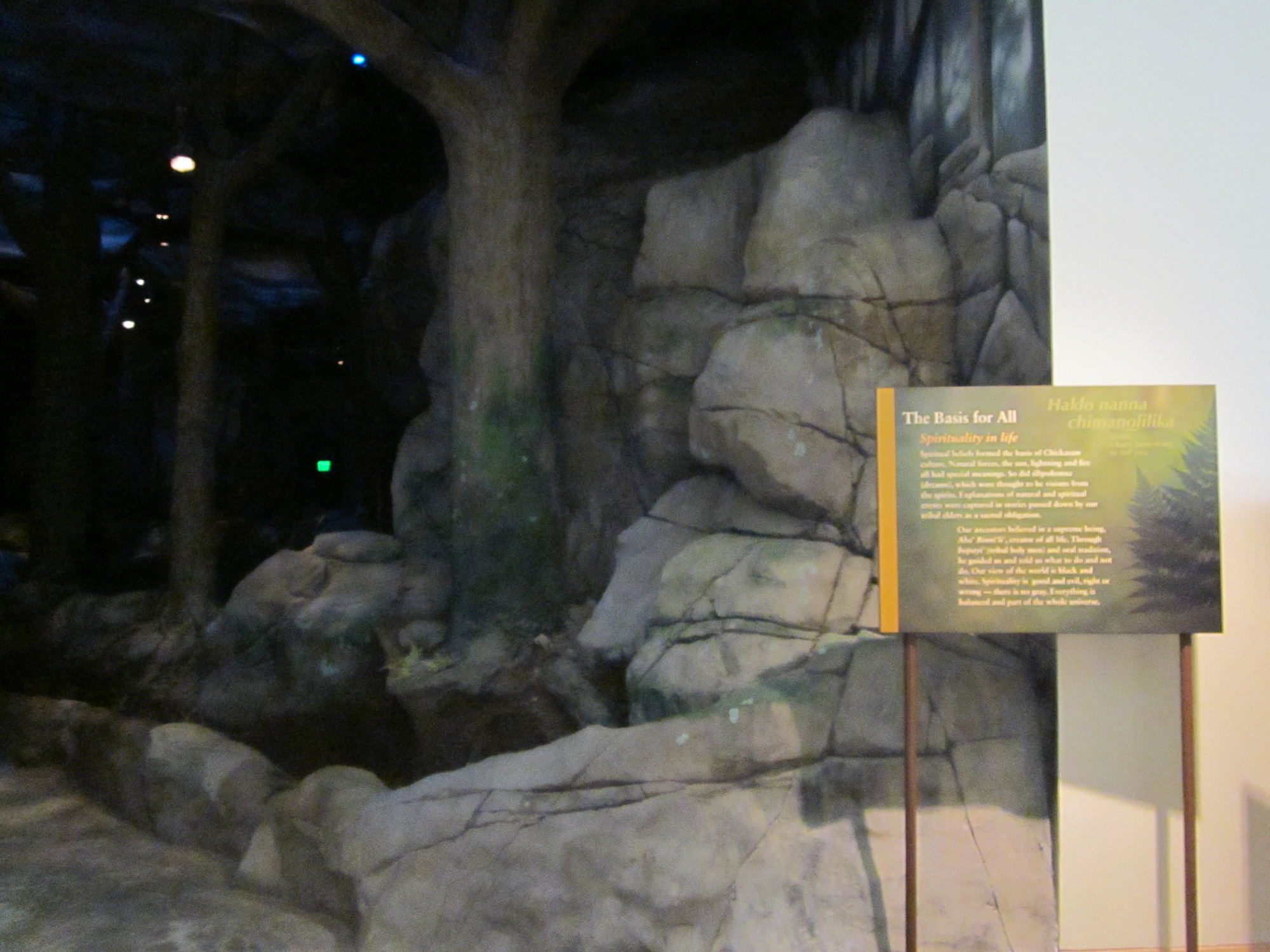 A cave-like exhibit with artificial rocks and wayside.
