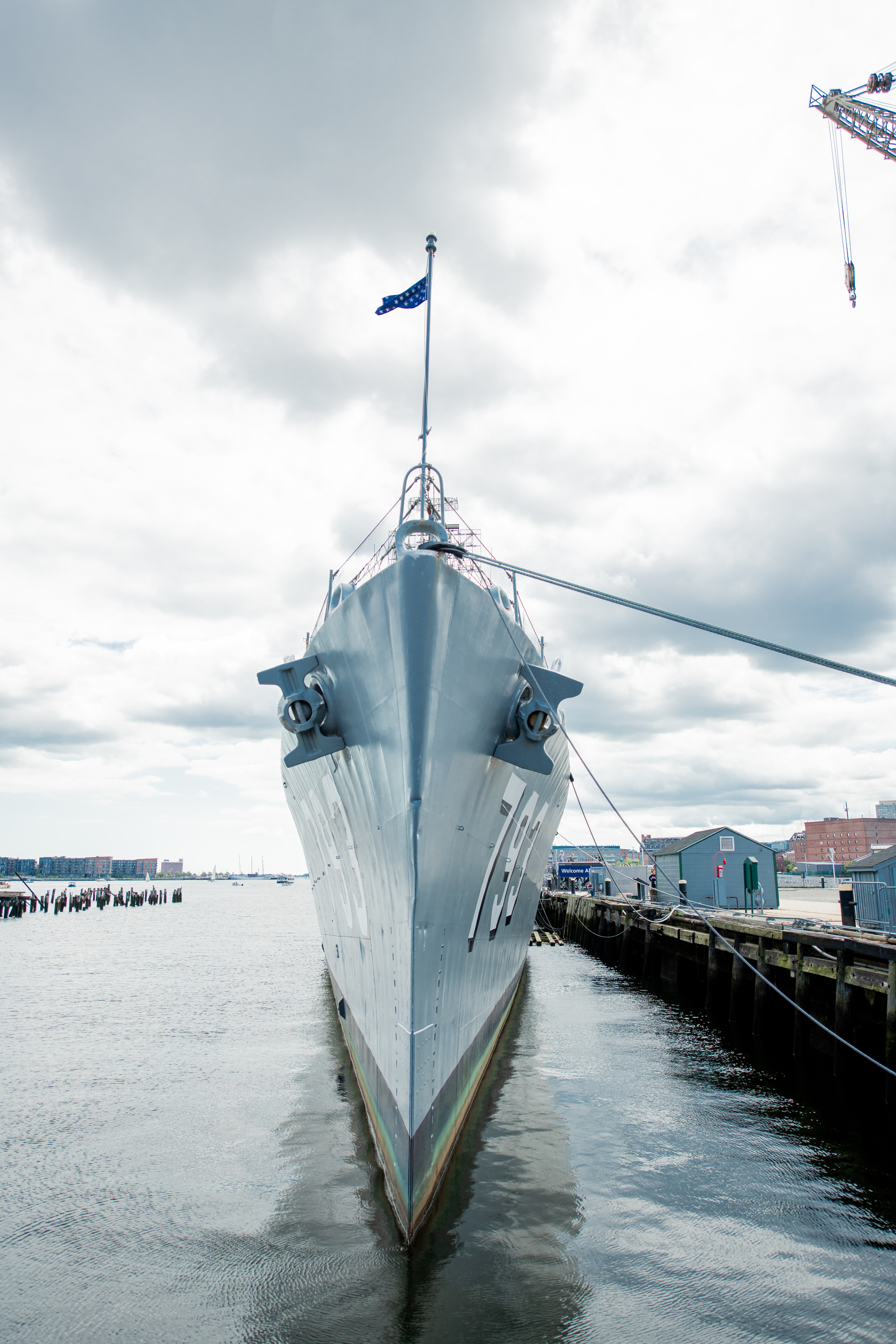 USS Cassin Young from the very front. Looking straight ahead is a view of the ship that is symmetrical down both sides, 793 can be seen written on both sides