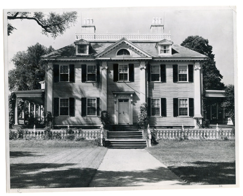 Facade of Georgian mansion. Black and white photo.