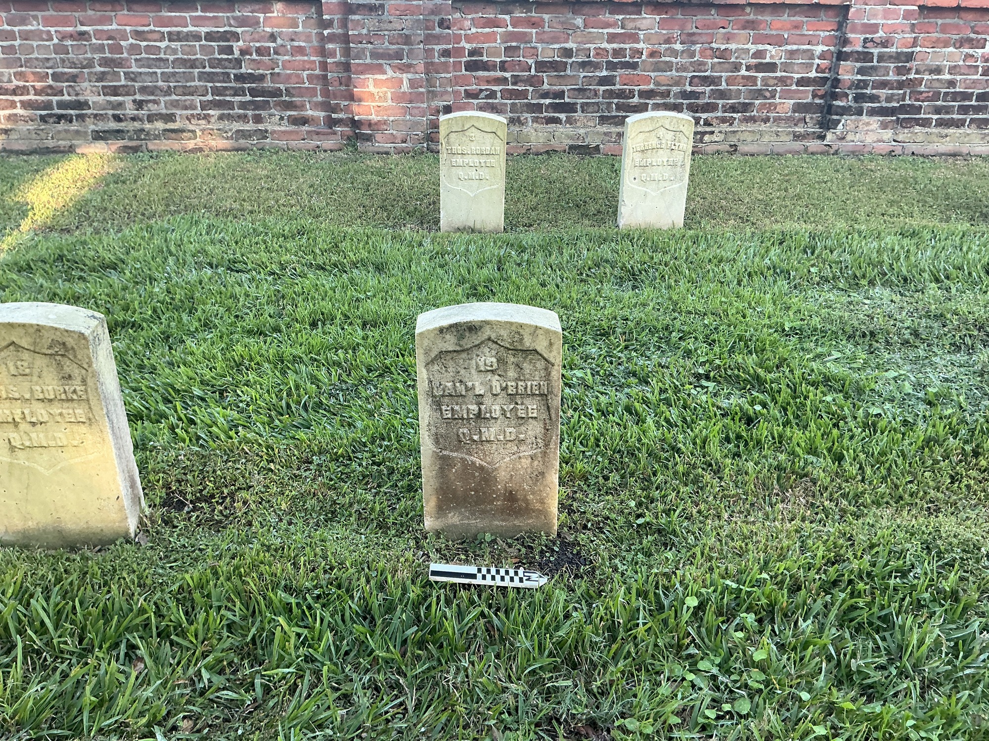 Extra image of historic upright marble headstone with recessed shield face.