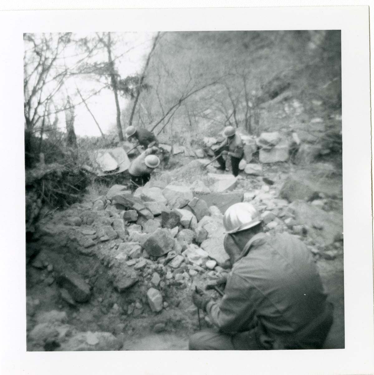 Workers repairing trail damage on the Hidden Canyon trail.
