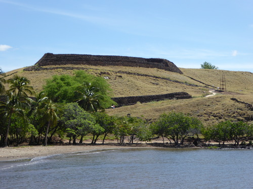 Across Pelekane Bay a view on top of a pu'u (hill) lays Pu'ukohola and Mailekini.