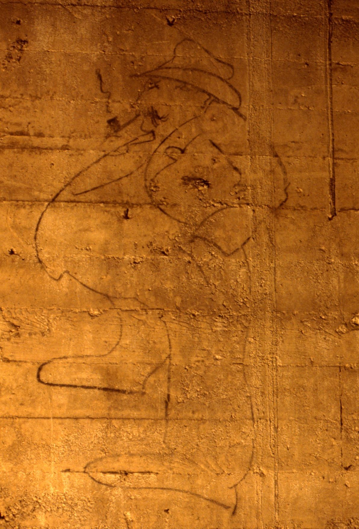 Graffiti of a construction boss caricature.