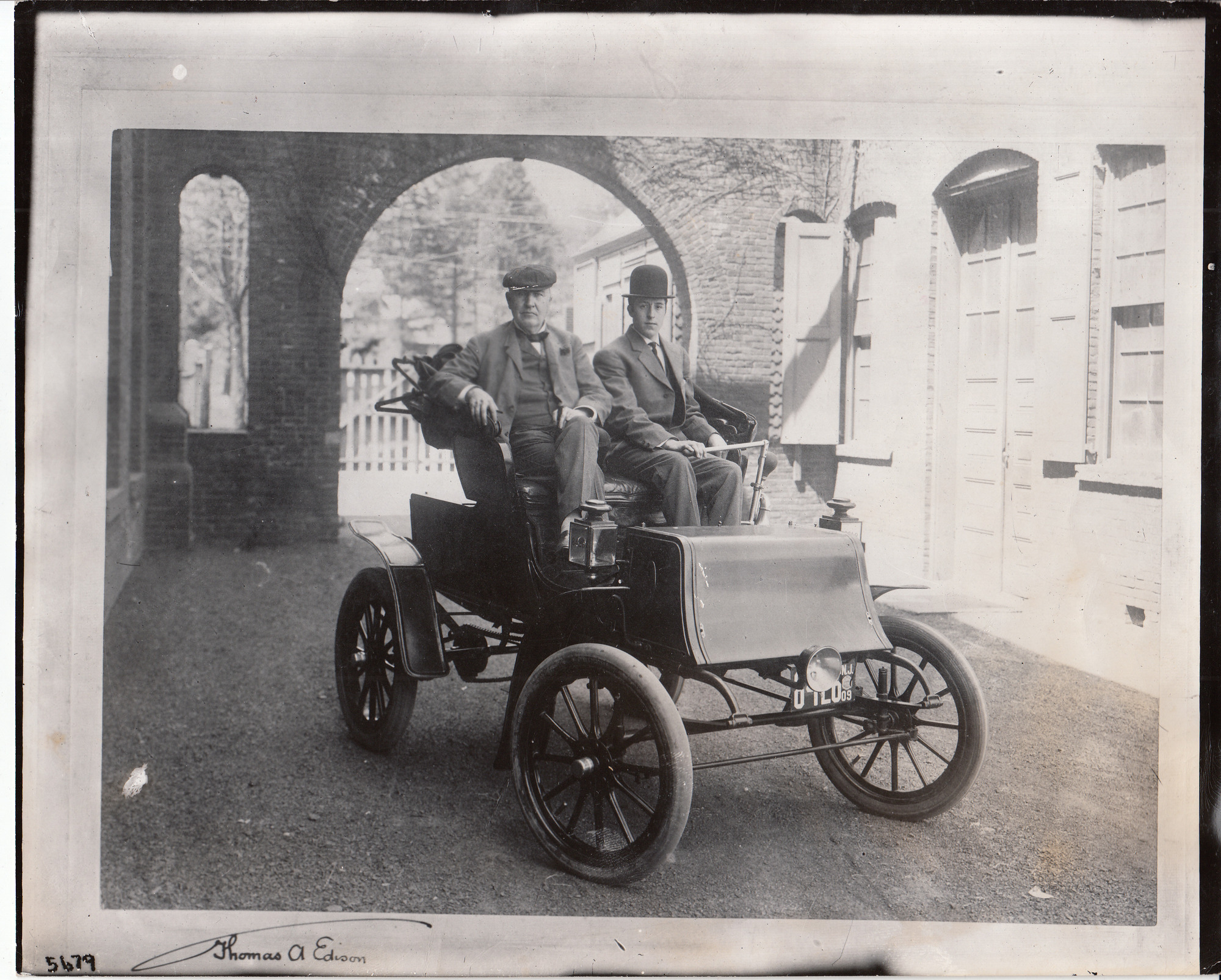 Thomas Edison and George Meister in a Studebaker electric runabout.