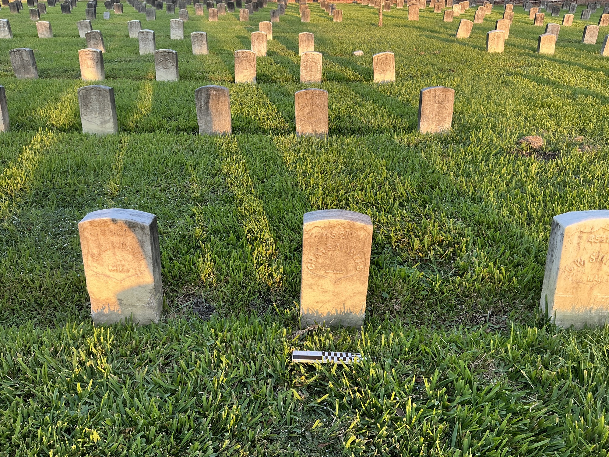 Extra image of historic upright marble headstone with recessed shield face.