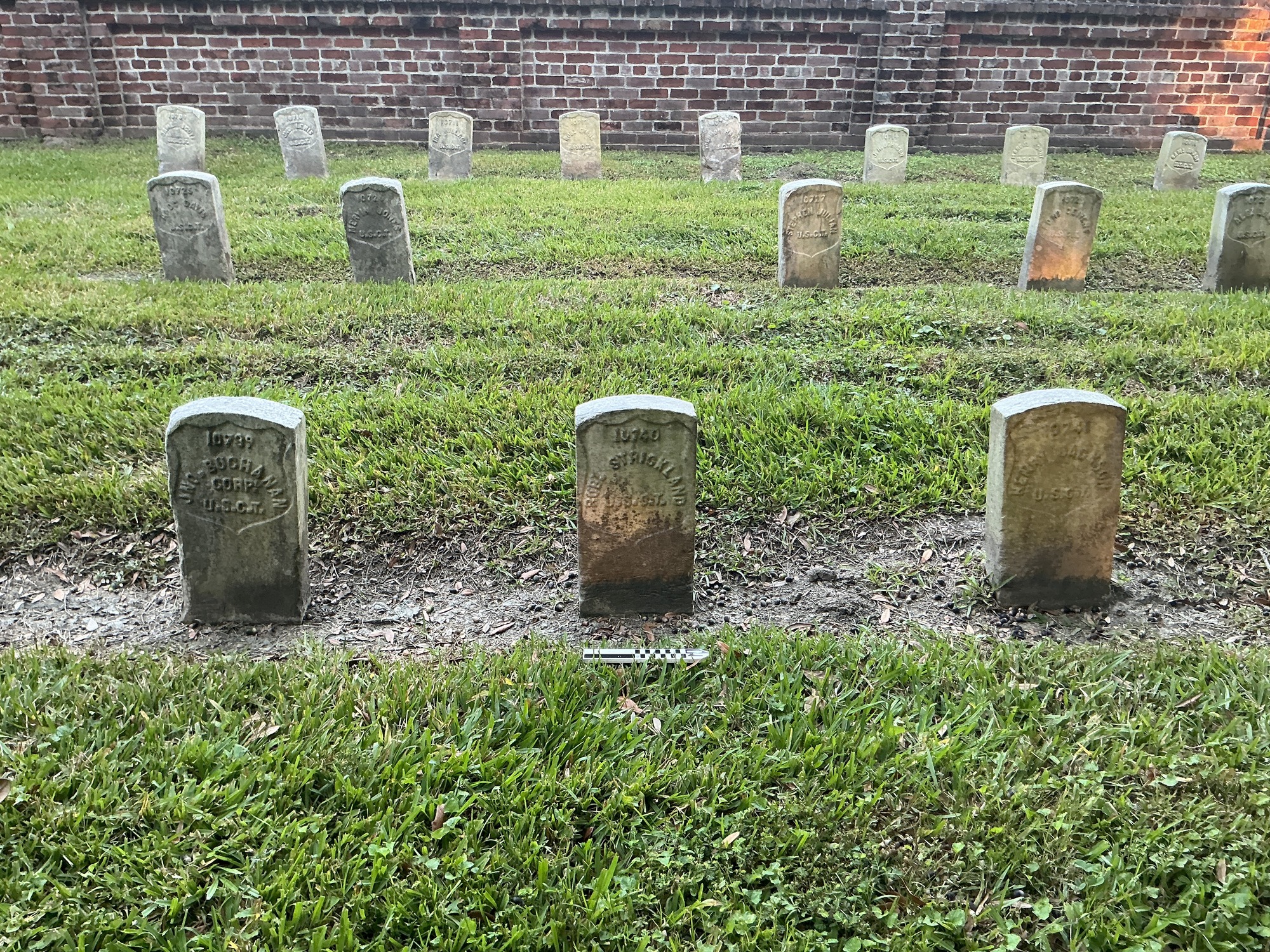 Extra image of historic upright marble headstone with recessed shield face.