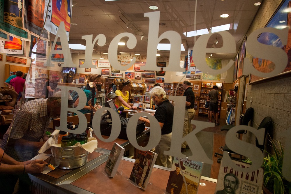 a view of a bookstore sales area through a glass window