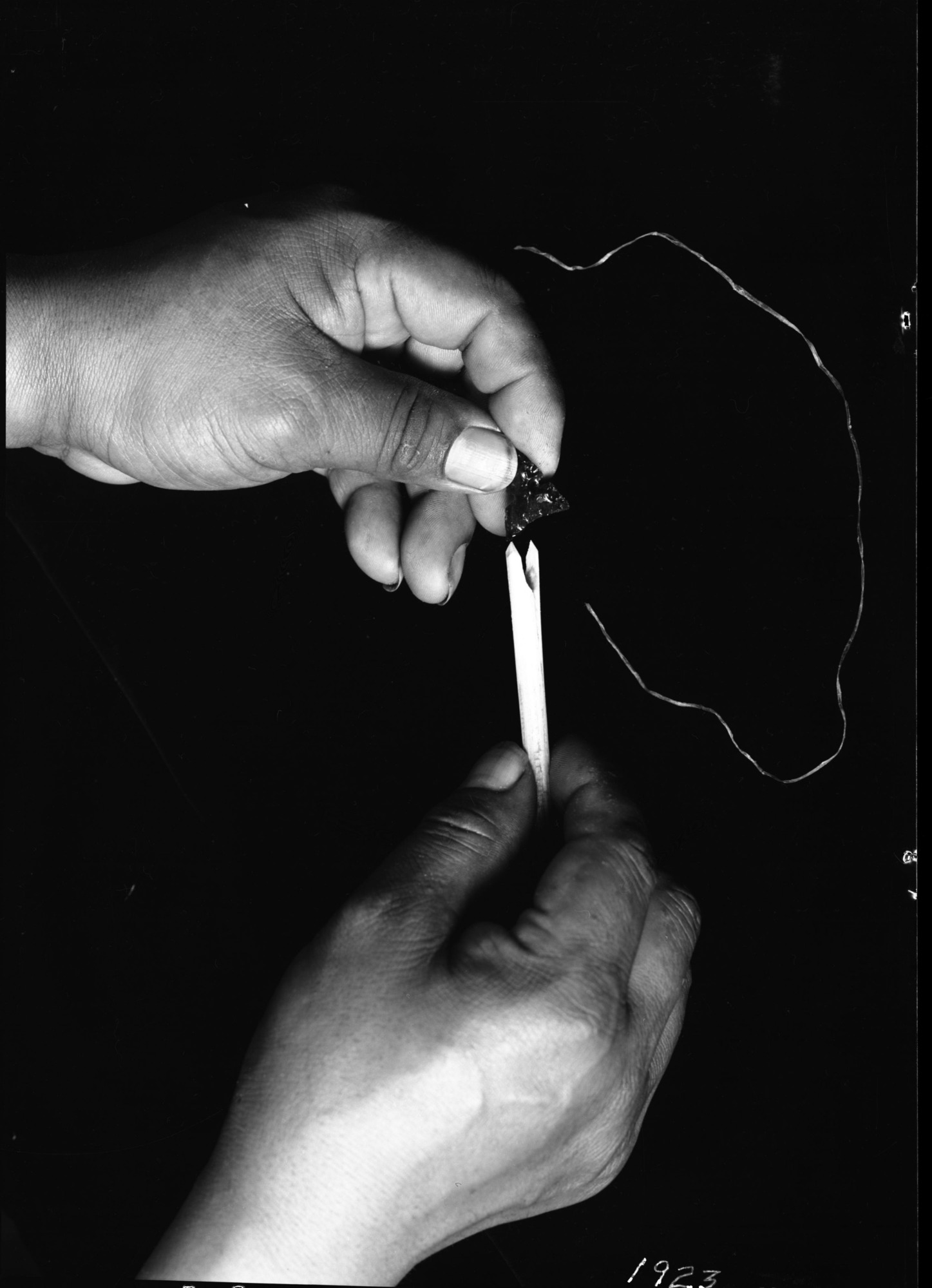 Le-me starting to attach arrowhead to shaft.