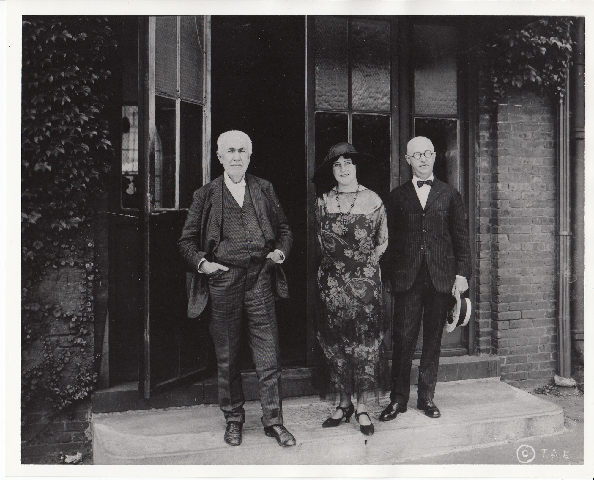 Thomas Edison, Anna Case, and Walter Miller standing outside Building 5 at Edison's West Orange Laboratory.