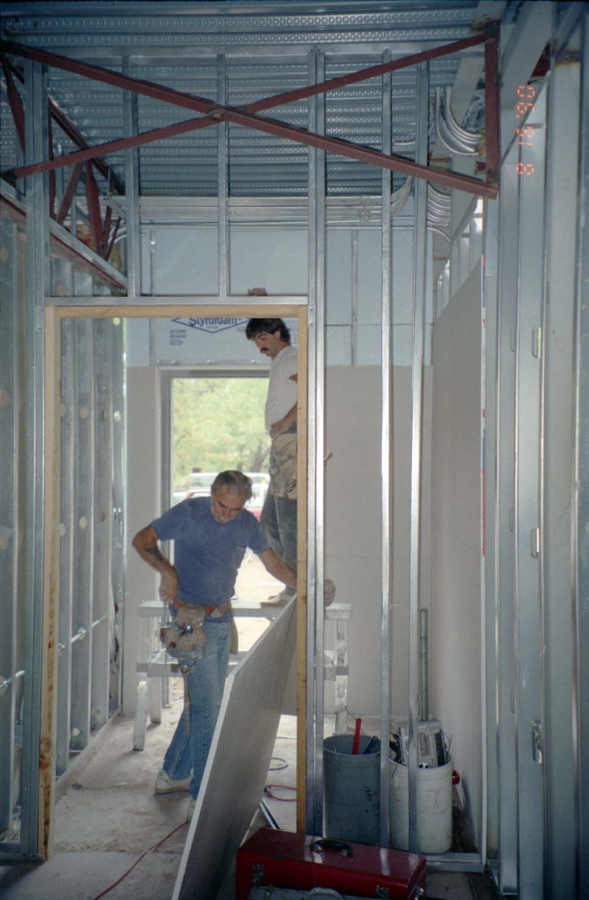 Men working on the construction of headquarters addition.