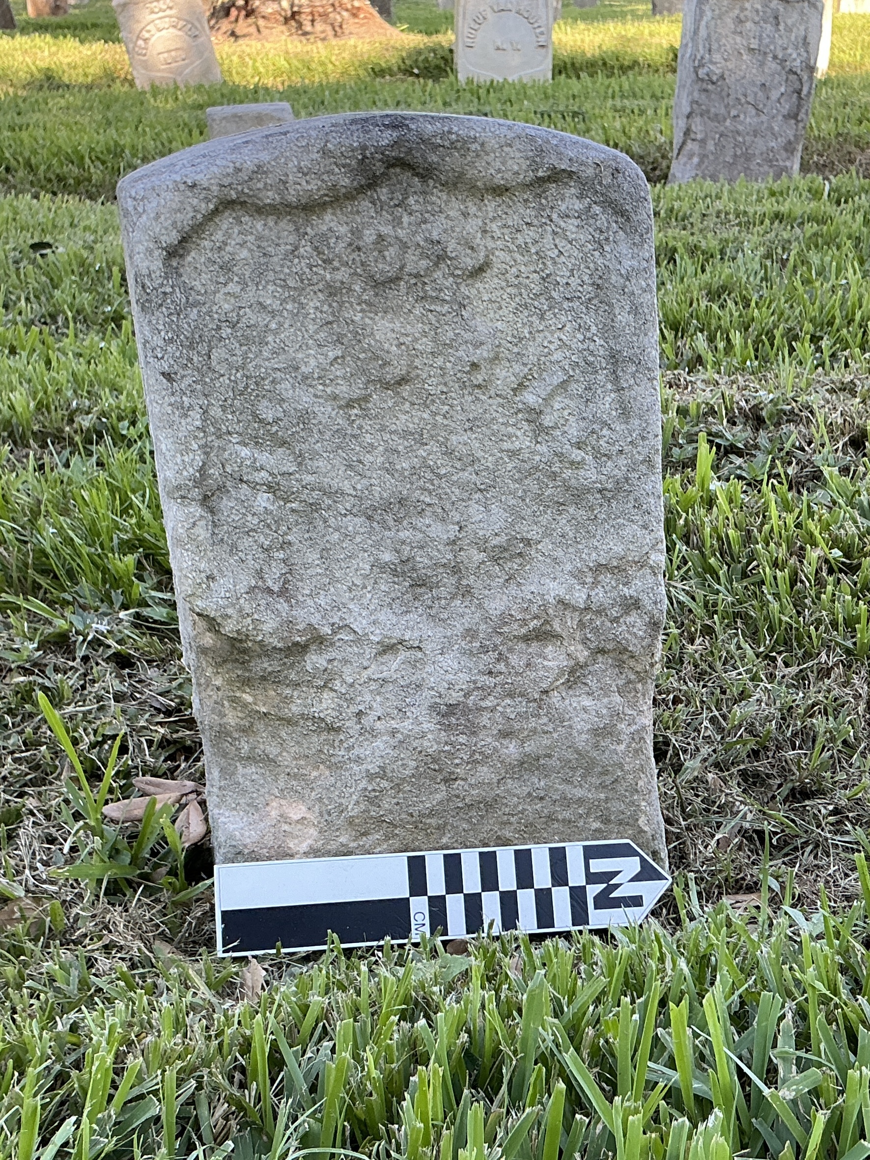 Extra image of historic upright marble headstone with recessed shield face.