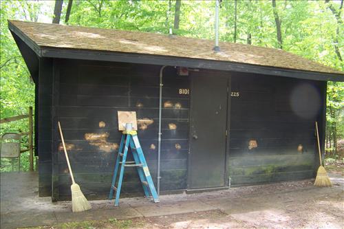 Paint and stain exterior of historic structures in camp 3 and camp 5 at Prince William Forest Park in June 2012.