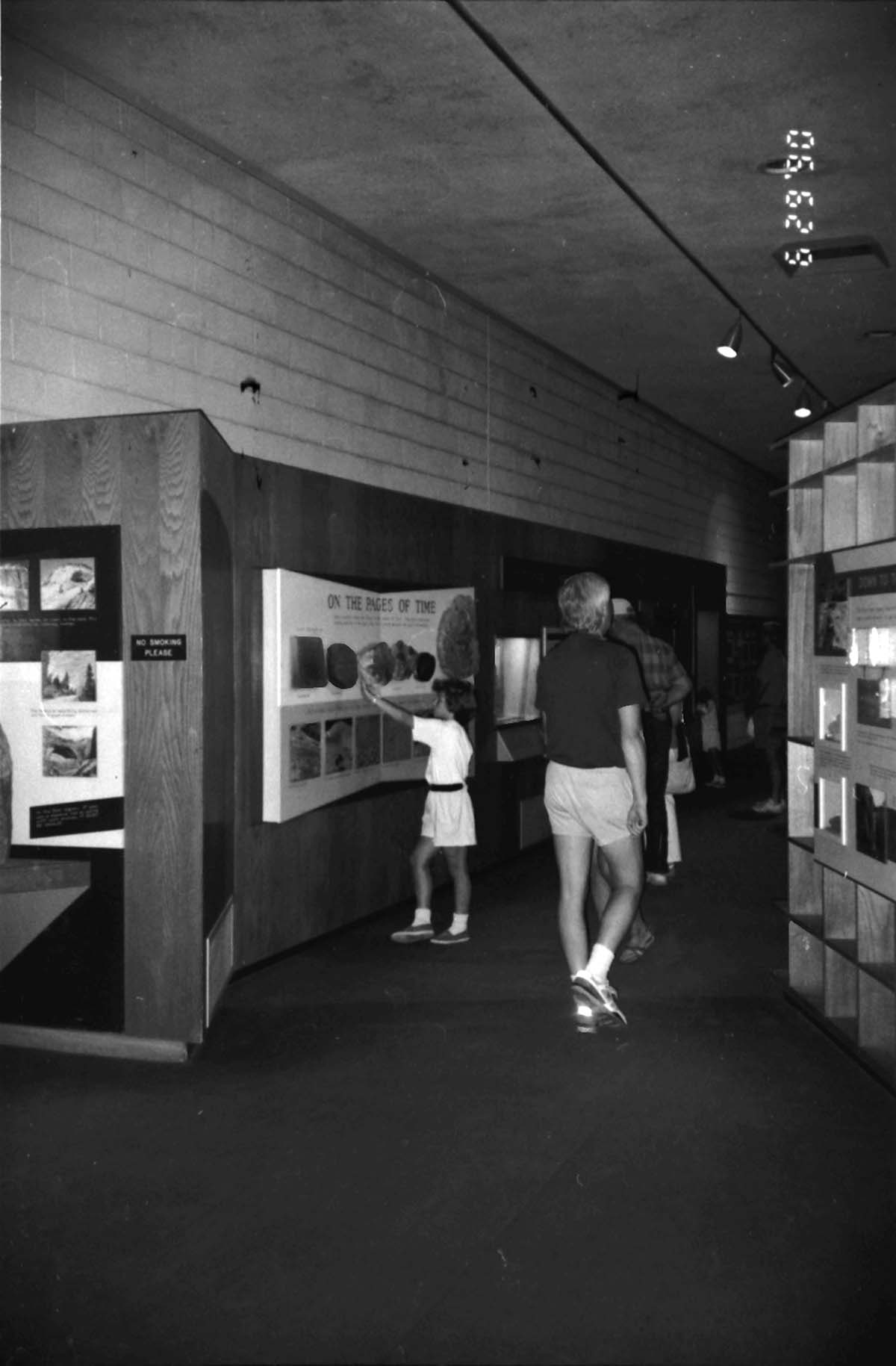 Visitors viewing the interpretive display in the old Mission 66 Visitor Center and Museum.