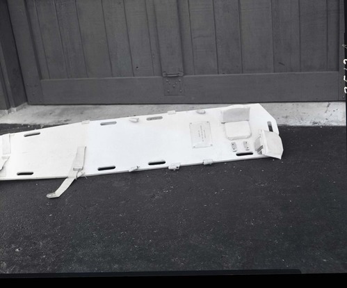 Special stretcher for first-aid in neck injuries designed by Rudy Lueck.