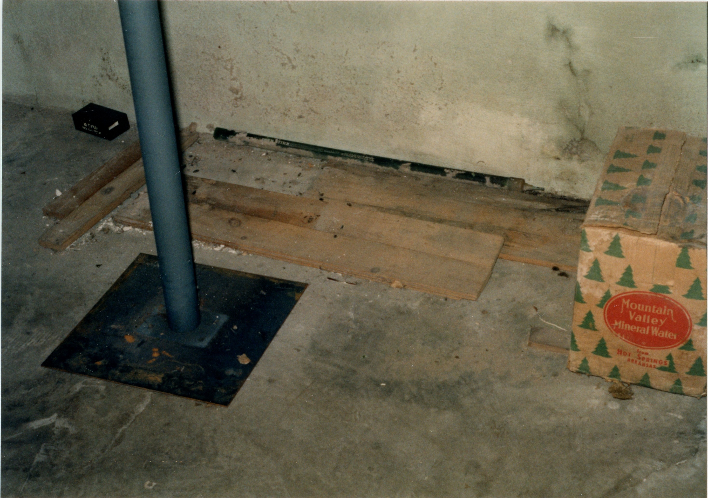 Wooden pieces stored under basement steps
