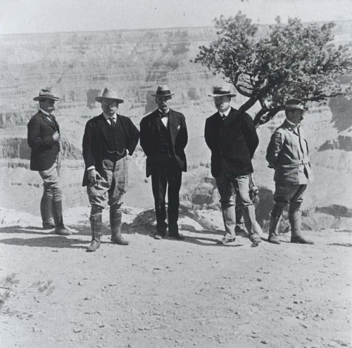 Theodore Roosevelt (second from left) and his party posing at the rim of the Grand Canyon.