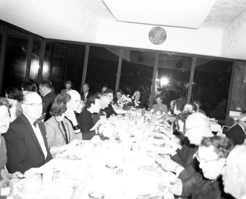 Men and women eating dinner at retirement party for Superintendent Paul R. Franke. Party held at the Driftwood Lodge, Springdale, Utah.