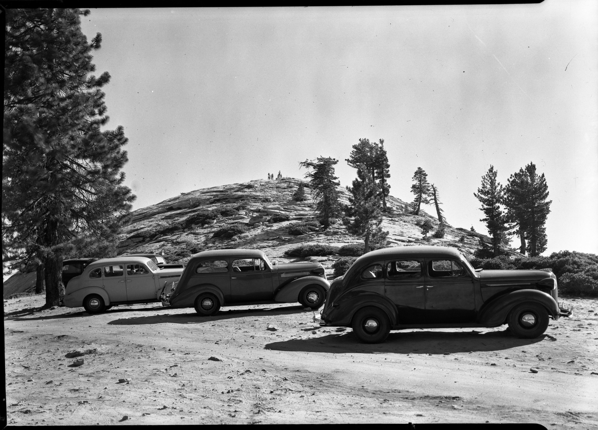 Copy Neg: Leroy Radanovich, April 2001. Cars parked on steep slope at Sentinel Dome.
