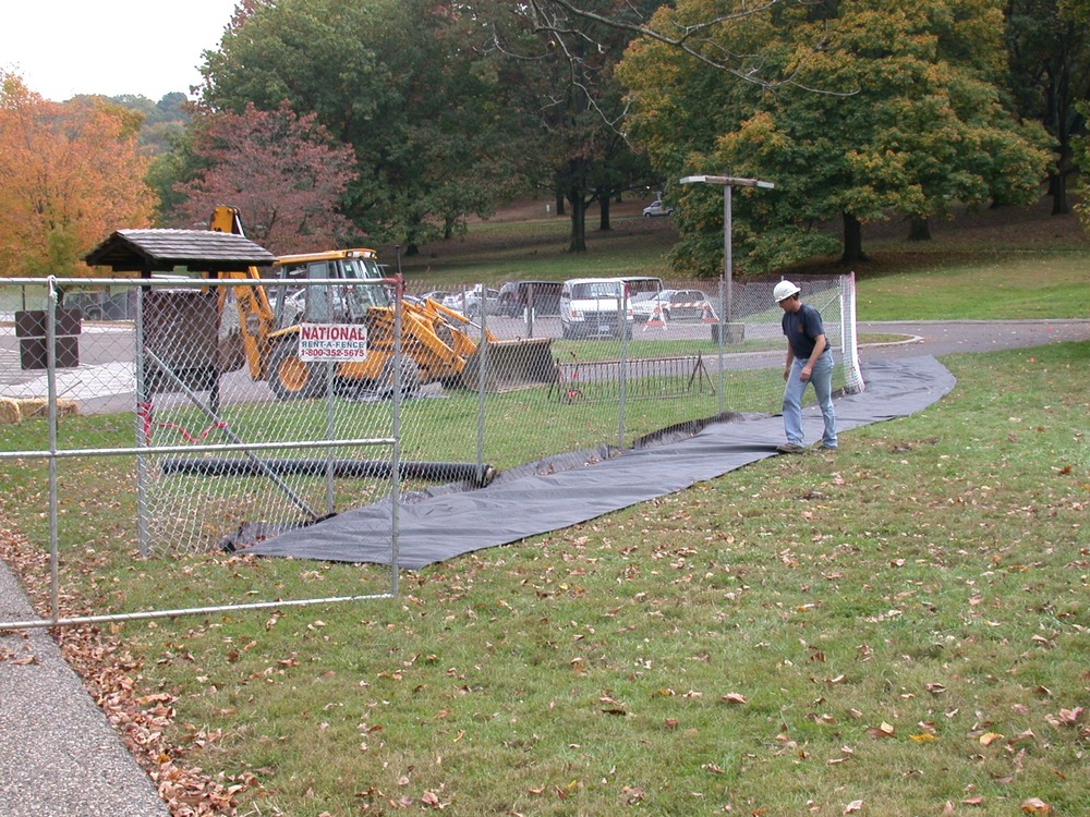 Crews building a temporary walkway at the General Washington's Headquarters complex. This work is Phase I of a project to rehabilitate the area.