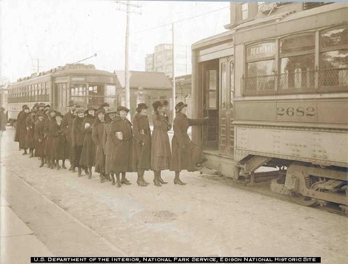 Edison employees learning to use trolley service in an orderly fashion at quitting time; 10.105/3