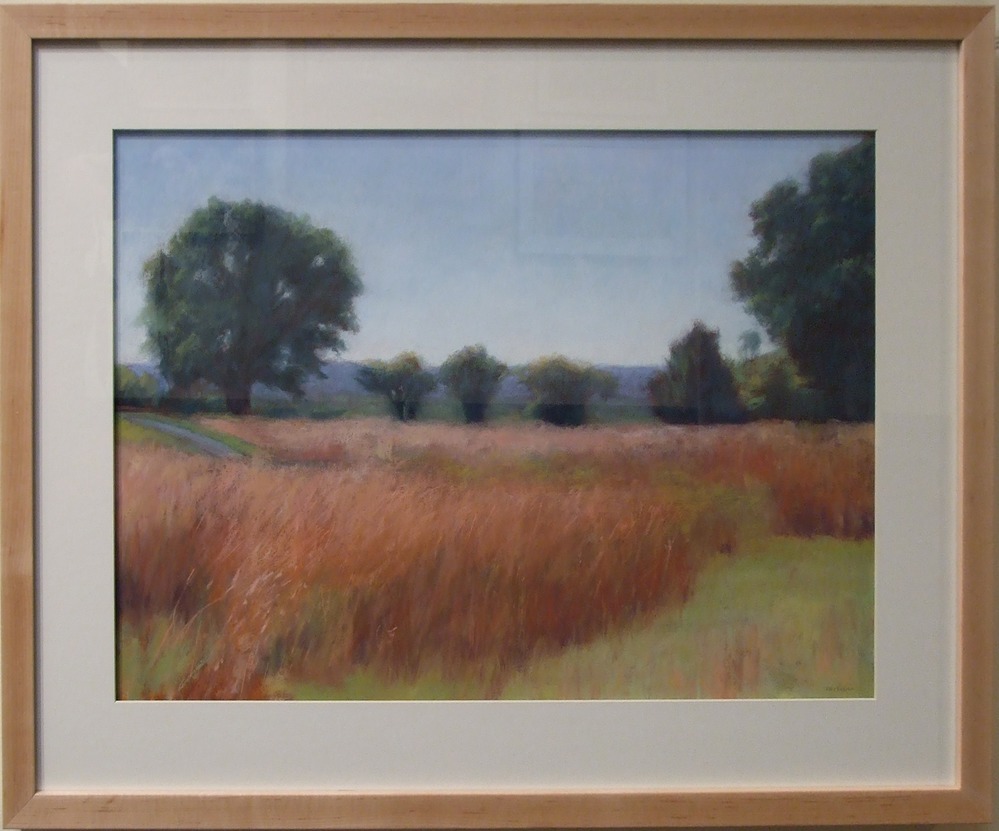 artist: Virginia McNiece Impressionistic piece depicting tall, brown field grasses, fully green trees and a walking path at Saratoga Battlefield.