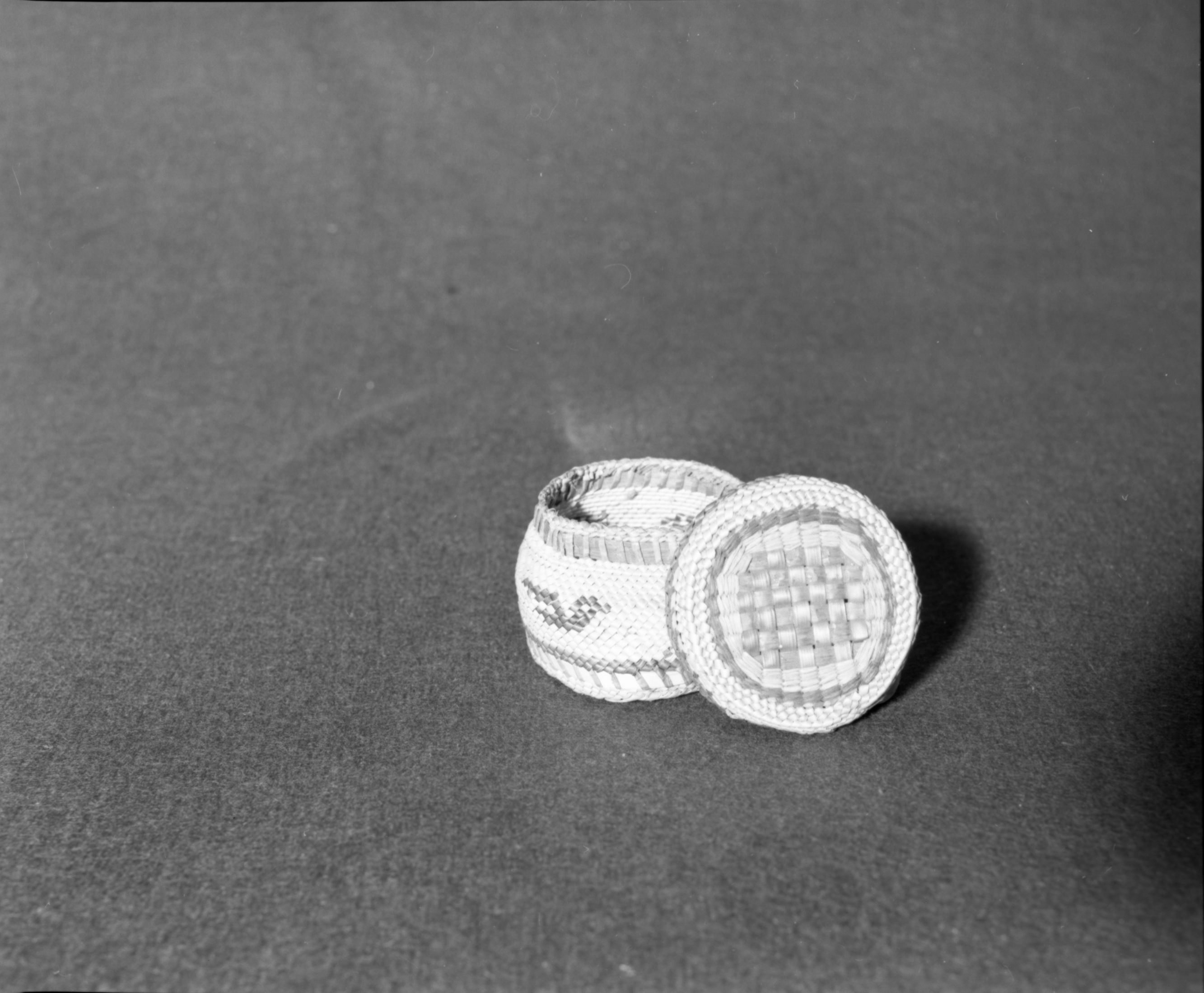 Marie Rozier Collection, Catalog No. 158. Object: Makah basket. Dimensions: 2 1/4 x 3". Materials: Red cedar bark, grass, commercial dyes. Collection History: Bought for $1 from Matilda McCarty, the weaver, in Washington in 1949. Photographed by Michael Dixon in December 1982. Catalogued by Craig Bates and Barbara Beroza. Yosemite Collections, National Park Service.