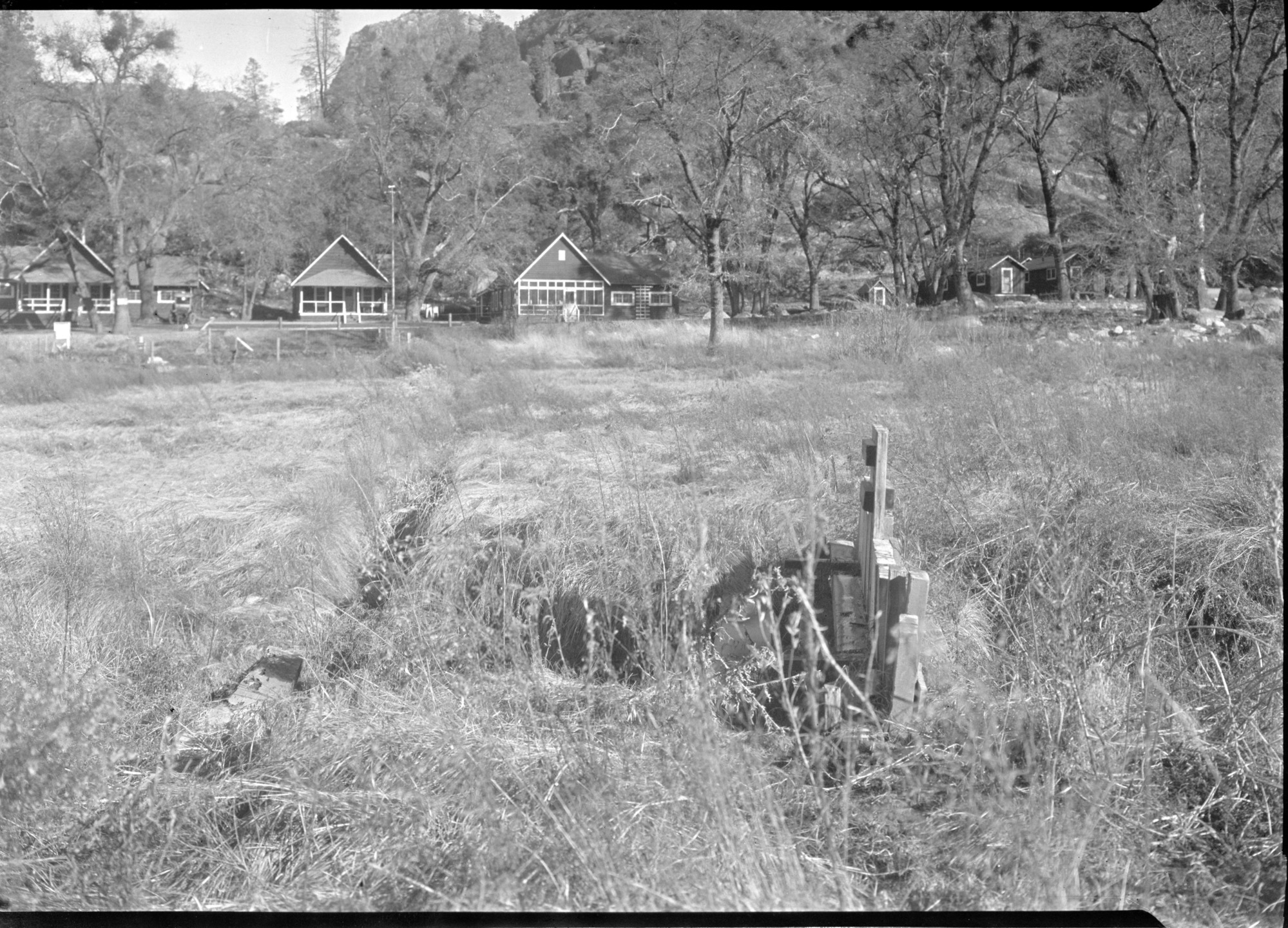 Sewage ditch from houses draining into meadow at Hetch Hetchy damsite and ditch later emptying into Lake. See "Report regarding auto camp at Canyon Ranch, YNP" (Separates Y-13a, #15)