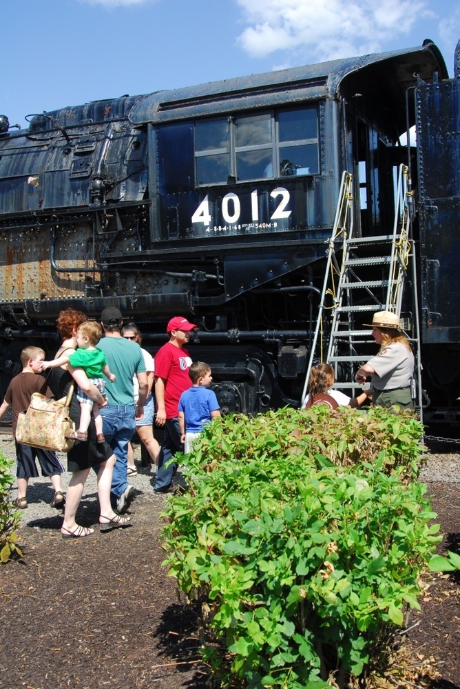 Park Ranger Suzanne Rozdilski greets visitors who had the unique opportunity to tour the cab of Steamtown NHS' 
