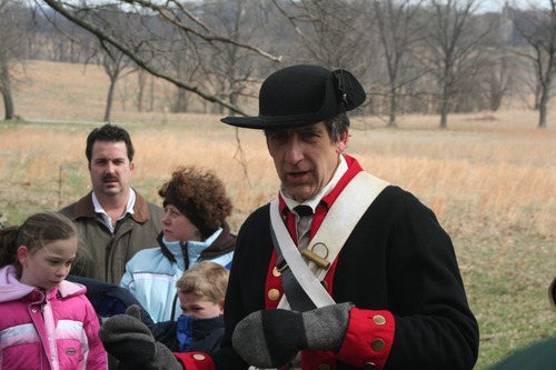 Ranger George describes the cannon procedures to the junior rangers.