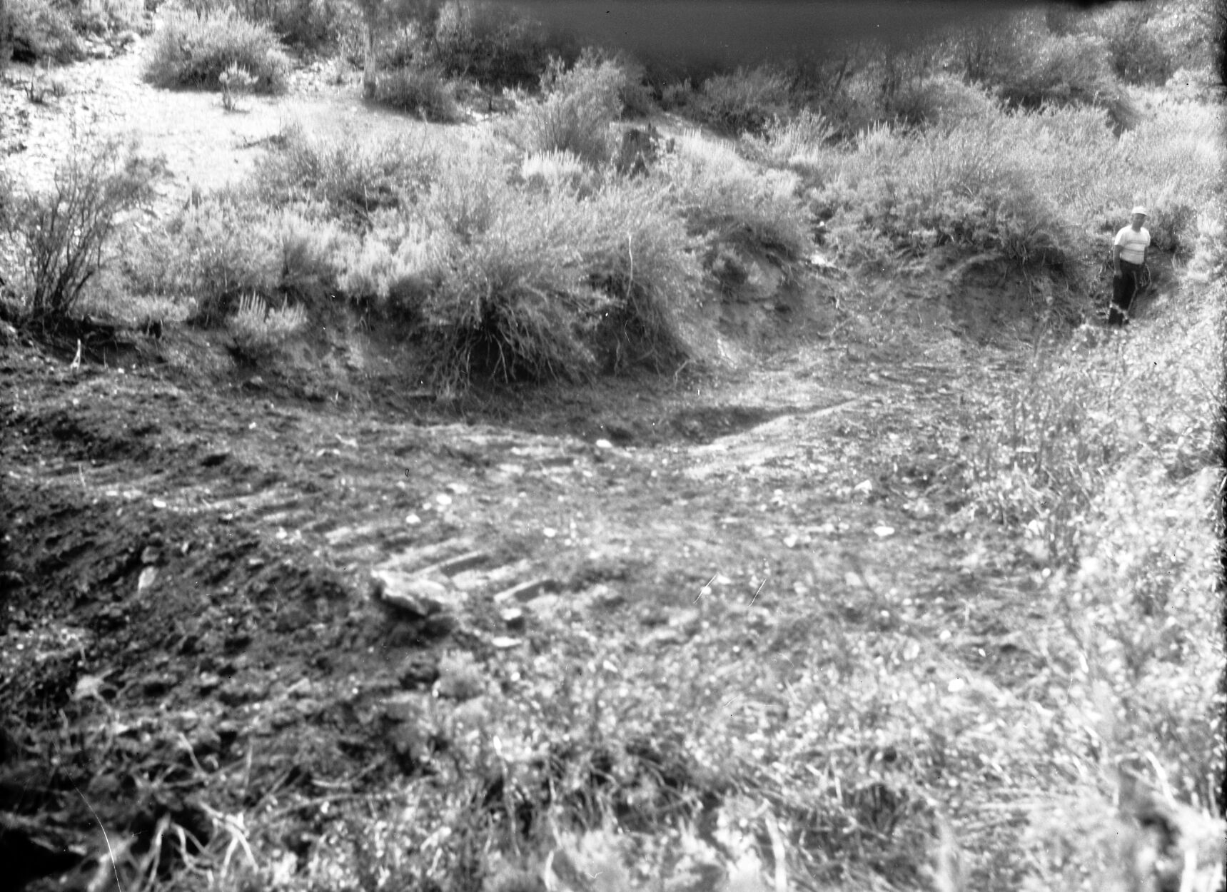 Detention dam near sawmill on East Rim. 40 cubic yards of material, drains 20 acres.